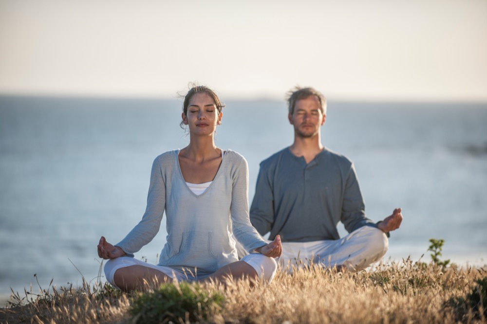 A couple sitting calmly outdoors